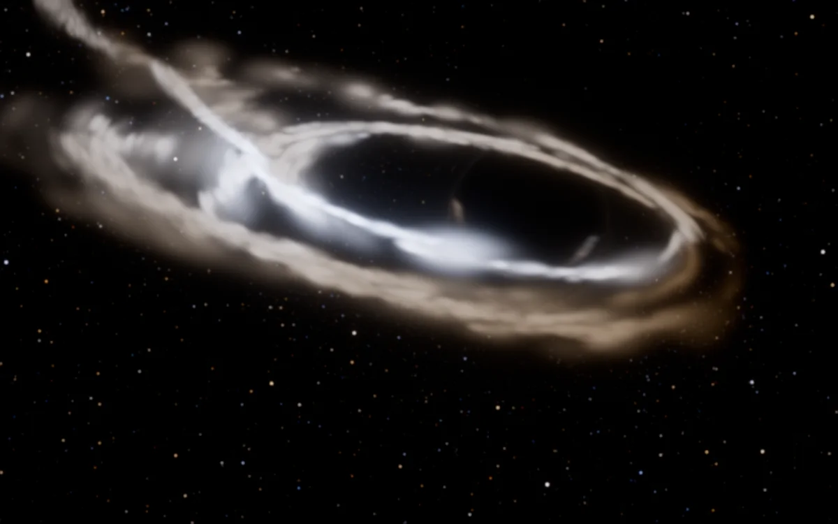 The debris crossing its own orbit and settling into a hot, bright ring around the black hole's shadow