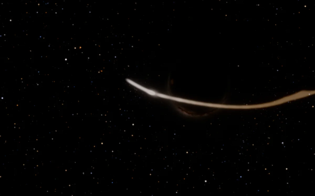 A thin stream of stellar debris arcing around an unseen black hole